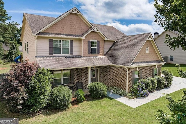 1148 Abe Lincoln Way, Jefferson, GA 30549 - craftsman inspired home with brick siding, a front yard, and a shingled roof