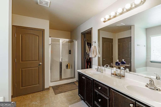 1148 Abe Lincoln Way, Jefferson, GA 30549 - full bath with a shower stall, double vanity, and a bath