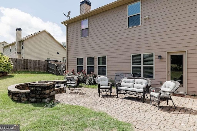 1148 Abe Lincoln Way, Jefferson, GA 30549 - rear view of property with a patio and an outdoor living space with a fire pit