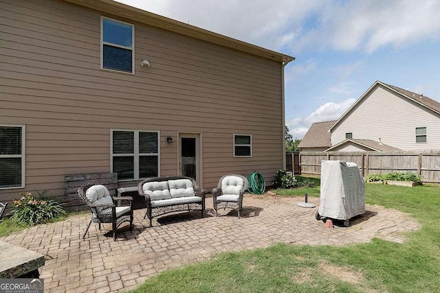1148 Abe Lincoln Way, Jefferson, GA 30549 - rear view of house featuring a patio area and an outdoor living space