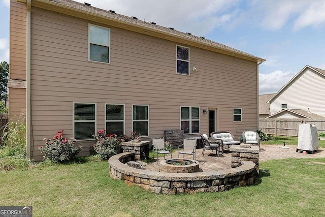 1148 Abe Lincoln Way, Jefferson, GA 30549 - rear view of property with a patio area and an outdoor living space with a fire pit