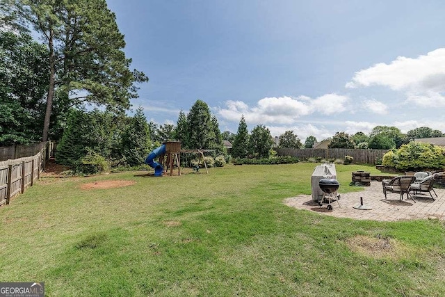 1148 Abe Lincoln Way, Jefferson, GA 30549 - view of yard featuring a playground, an outdoor fire pit, and a patio