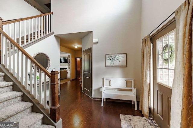 1148 Abe Lincoln Way, Jefferson, GA 30549 - entryway with a towering ceiling, wood finished floors, and stairs