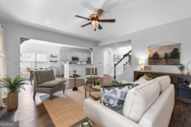 3 Stonebridge Way, Newnan, GA 30265 - living room with stairs, ceiling fan, arched walkways, dark wood-style floors, and recessed lighting