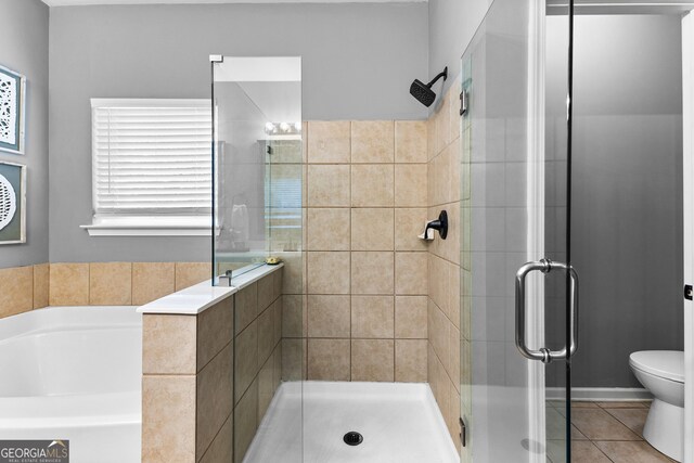 3 Stonebridge Way, Newnan, GA 30265 - bathroom with a shower stall, a garden tub, tile patterned floors, and toilet