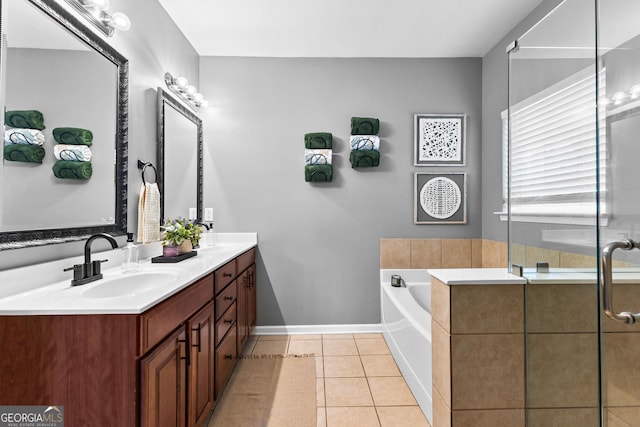 3 Stonebridge Way, Newnan, GA 30265 - bathroom with double vanity, a garden tub, baseboards, tile patterned floors, and a shower with shower door