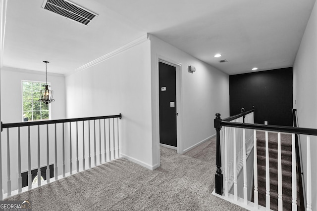 3 Stonebridge Way, Newnan, GA 30265 - corridor with an upstairs landing, a chandelier, baseboards, carpet, and crown molding