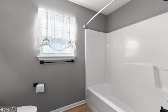3 Stonebridge Way, Newnan, GA 30265 - full bathroom featuring tub / shower combination, toilet, baseboards, and wood finished floors
