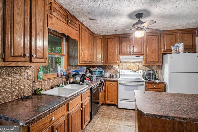 198 Hickory Ave, Demorest, GA 30535 - kitchen featuring white appliances, under cabinet range hood, a sink, and dark countertops