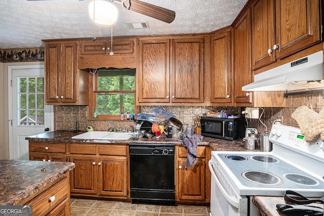 198 Hickory Ave, Demorest, GA 30535 - kitchen featuring black appliances, under cabinet range hood, brown cabinets, and a sink