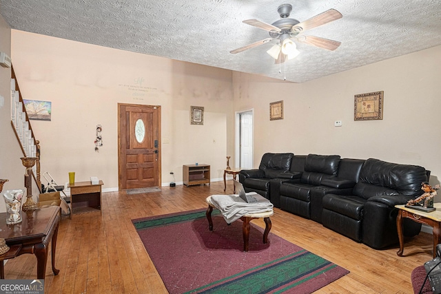 198 Hickory Ave, Demorest, GA 30535 - living room featuring hardwood / wood-style flooring, ceiling fan, a textured ceiling, and stairway