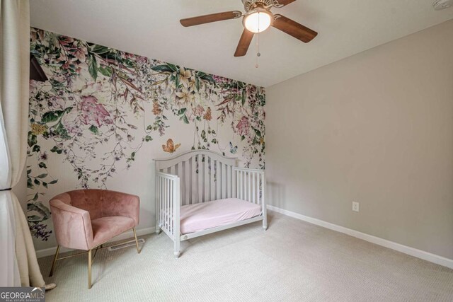 1137 Poplar Log Pl, Austell, GA 30168 - carpeted bedroom with wallpapered walls, baseboards, ceiling fan, and an accent wall