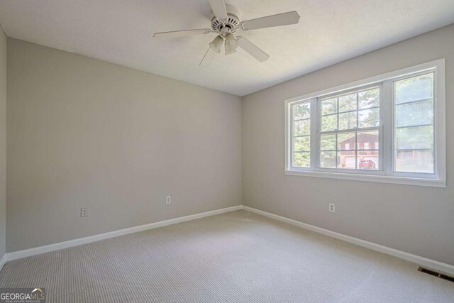 1137 Poplar Log Pl, Austell, GA 30168 - empty room featuring carpet, baseboards, and a ceiling fan