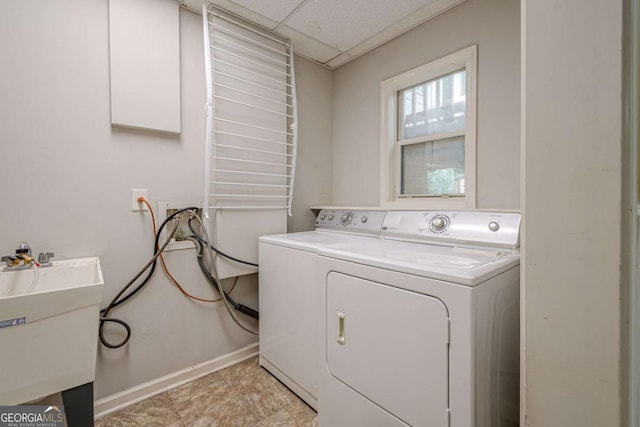 1137 Poplar Log Pl, Austell, GA 30168 - laundry area featuring washer and clothes dryer and baseboards