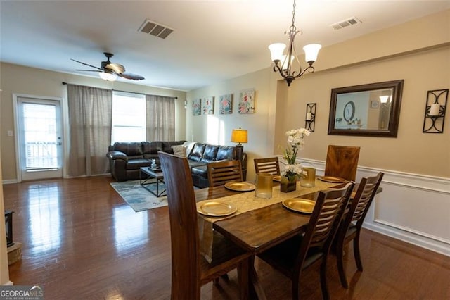 6089 Indian Wood, Mableton, GA 30126 - dining room featuring wainscoting, dark wood-style flooring, ceiling fan, and a chandelier