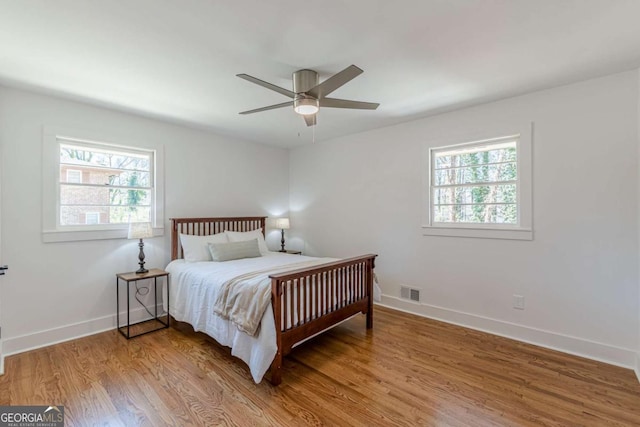 442 Mountain Park Trl, Stone Mountain, GA 30087 - bedroom featuring wood finished floors, baseboards, and a ceiling fan