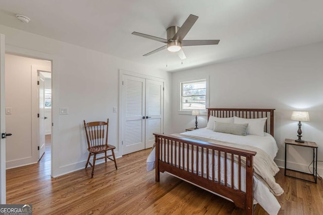 442 Mountain Park Trl, Stone Mountain, GA 30087 - bedroom with wood finished floors, a closet, baseboards, and a ceiling fan