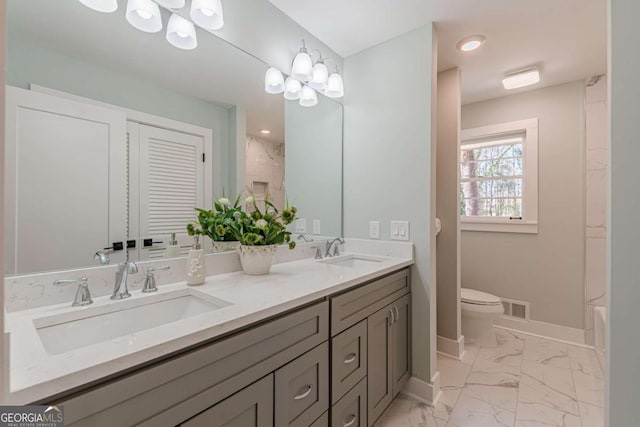 442 Mountain Park Trl, Stone Mountain, GA 30087 - bathroom featuring double vanity, marble finish floors, toilet, baseboards, and shower / bathtub combination