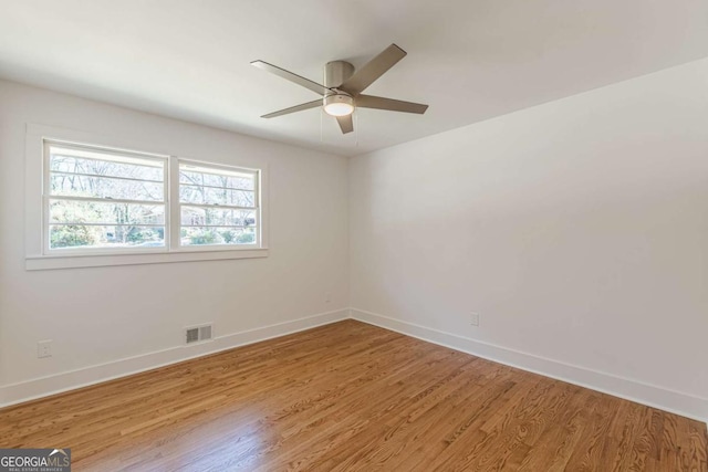 442 Mountain Park Trl, Stone Mountain, GA 30087 - unfurnished room with light wood-type flooring, baseboards, and a ceiling fan