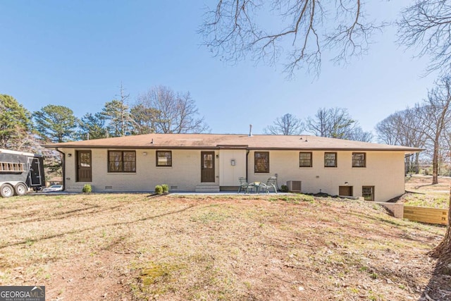 442 Mountain Park Trl, Stone Mountain, GA 30087 - view of front of property featuring a patio area, central AC unit, brick siding, crawl space, and a front yard