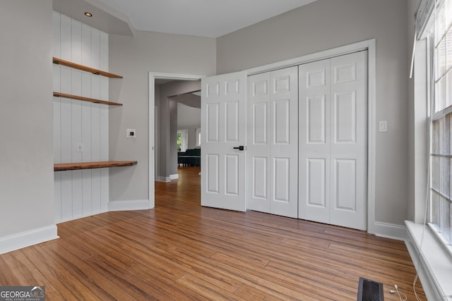 1133 Stone Brook Ln, Bremen, GA 30110 - unfurnished bedroom featuring wood finished floors, baseboards, and a closet