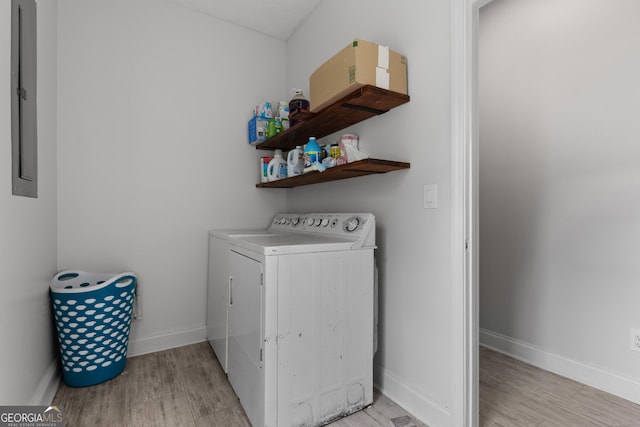 1133 Stone Brook Ln, Bremen, GA 30110 - washroom with light wood-style floors, washing machine and clothes dryer, baseboards, and electric panel