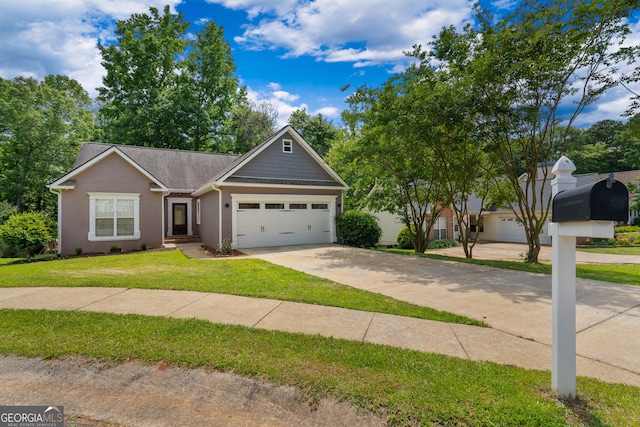 1133 Stone Brook Ln, Bremen, GA 30110 - view of front of home with a garage, concrete driveway, a front yard, and stucco siding