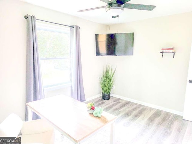 2190 Gordon Cir SE, Smyrna, GA 30080 - unfurnished dining area featuring wood finished floors, a ceiling fan, and baseboards