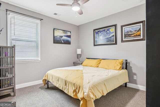 160 Amherst Way, Fayetteville, GA 30215 - carpeted bedroom featuring baseboards, multiple windows, and a ceiling fan