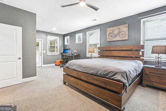 160 Amherst Way, Fayetteville, GA 30215 - carpeted bedroom featuring multiple windows, baseboards, a ceiling fan, and a desk