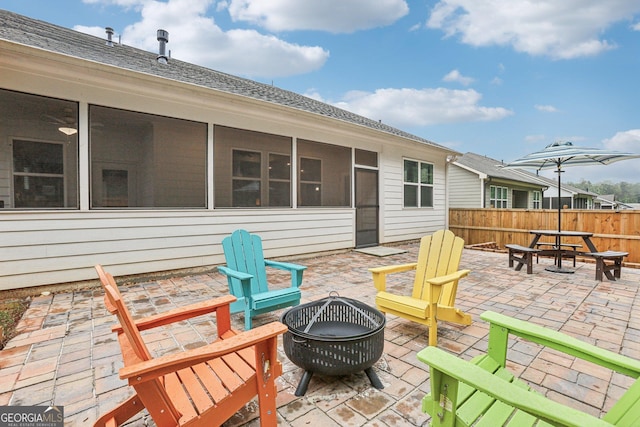 160 Amherst Way, Fayetteville, GA 30215 - view of patio featuring an outdoor fire pit and a sunroom