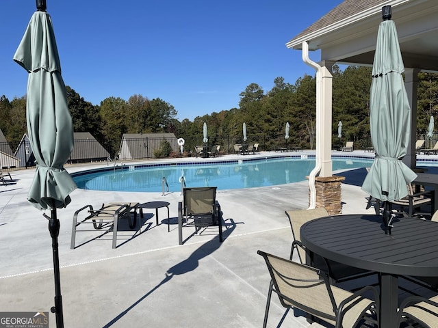 160 Amherst Way, Fayetteville, GA 30215 - community pool featuring a patio area and view of wooded area