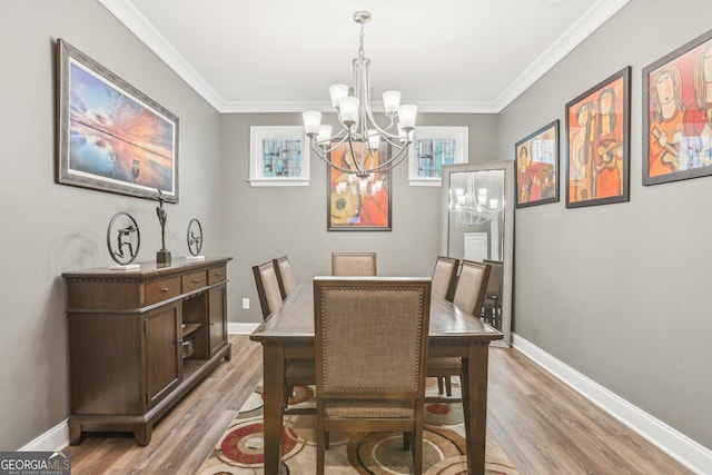 160 Amherst Way, Fayetteville, GA 30215 - dining room featuring a chandelier, light wood-style floors, ornamental molding, and baseboards
