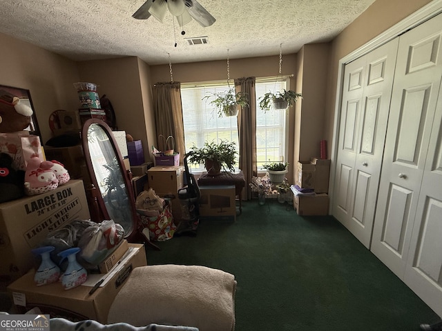650 Flippen Rd, Stockbridge, GA 30281 - living area with carpet floors, ceiling fan, and a textured ceiling