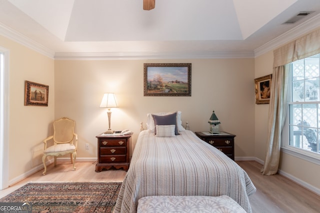 1115 Hunters Creek Ct, Lawrenceville, GA 30043 - bedroom featuring a raised ceiling, multiple windows, wood finished floors, and ornamental molding