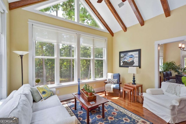 180 Shadow Wood Bnd, Saint Simons, GA 31522 - living area with healthy amount of natural light, wood finished floors, and ceiling fan