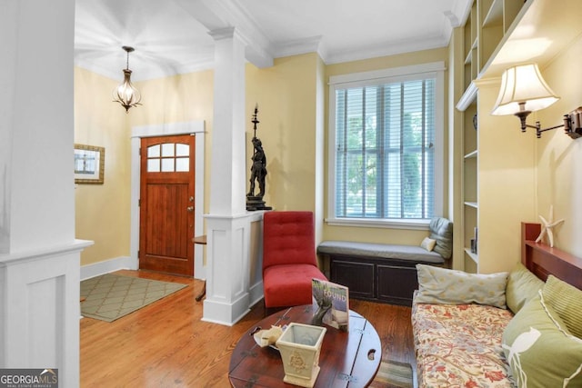 180 Shadow Wood Bnd, Saint Simons, GA 31522 - entryway with decorative columns, crown molding, and wood finished floors