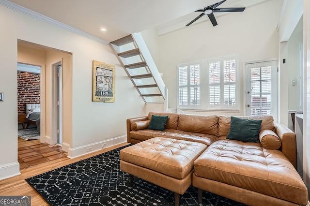 1078 Piedmont Ave NE Unit 206, Atlanta, GA 30309 - living room featuring ceiling fan, light wood-type flooring, stairway, ornamental molding, and recessed lighting