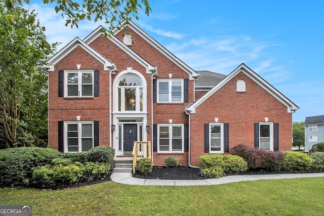2330 Springmonte Pl, Cumming, GA 30041 - traditional-style home with a front lawn and brick siding