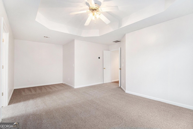 2330 Springmonte Pl, Cumming, GA 30041 - unfurnished room featuring a tray ceiling, carpet, ceiling fan, and baseboards