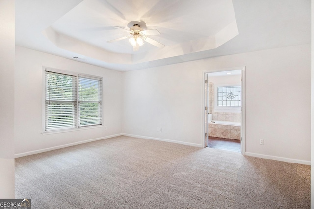 2330 Springmonte Pl, Cumming, GA 30041 - unfurnished room featuring a raised ceiling, carpet floors, a ceiling fan, and baseboards