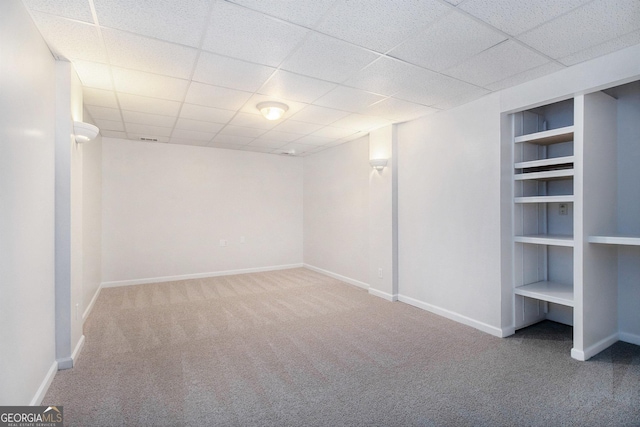 2330 Springmonte Pl, Cumming, GA 30041 - finished below grade area featuring carpet flooring, built in features, baseboards, and a paneled ceiling