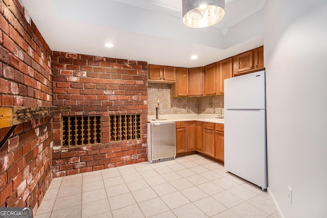 2330 Springmonte Pl, Cumming, GA 30041 - kitchen with freestanding refrigerator, dishwashing machine, light countertops, a sink, and ornamental molding