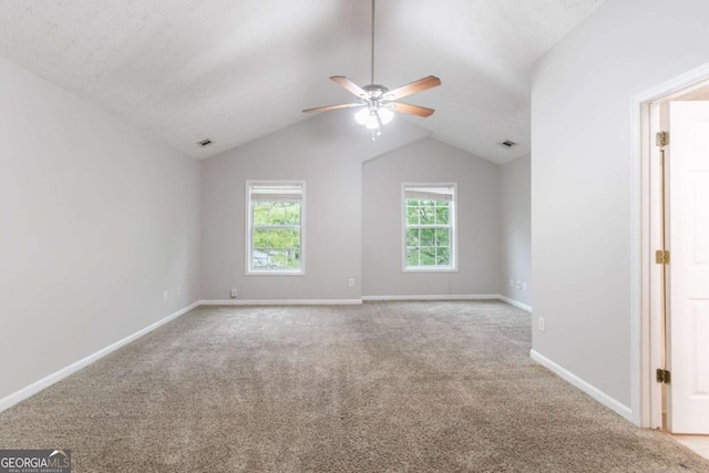 541 Shadow Valley Ct, Lithonia, GA 30058 - carpeted empty room with ceiling fan, baseboards, and vaulted ceiling