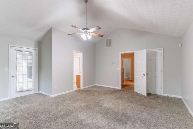 541 Shadow Valley Ct, Lithonia, GA 30058 - unfurnished bedroom featuring vaulted ceiling, carpet floors, and baseboards