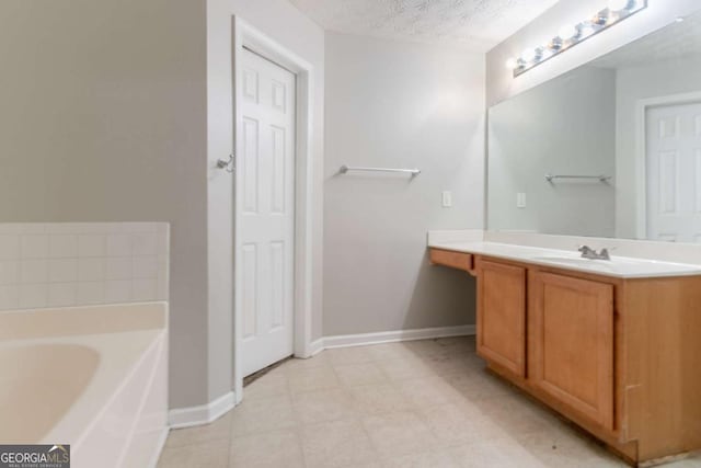 541 Shadow Valley Ct, Lithonia, GA 30058 - full bath with vanity, a bath, baseboards, and a textured ceiling
