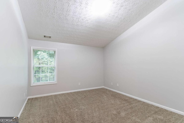 541 Shadow Valley Ct, Lithonia, GA 30058 - unfurnished room with a textured ceiling, carpet floors, and baseboards