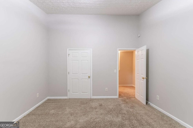 541 Shadow Valley Ct, Lithonia, GA 30058 - carpeted spare room featuring a textured ceiling and baseboards