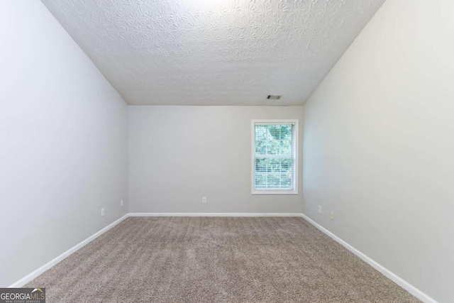 541 Shadow Valley Ct, Lithonia, GA 30058 - carpeted empty room with a textured ceiling and baseboards