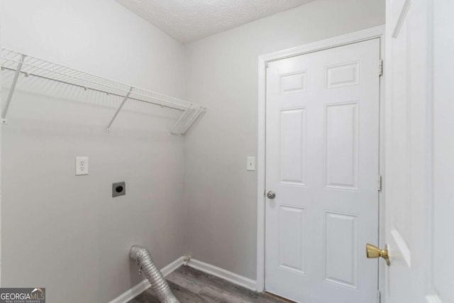 541 Shadow Valley Ct, Lithonia, GA 30058 - laundry area featuring hookup for an electric dryer, baseboards, and wood finished floors
